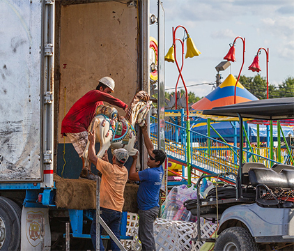 Carnival workers unloading